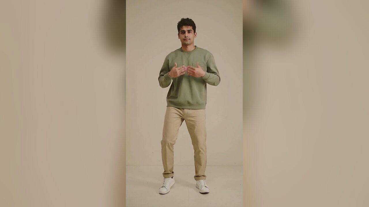 Warm, energetic vertical portrait of a person ready for a short Black Friday social video